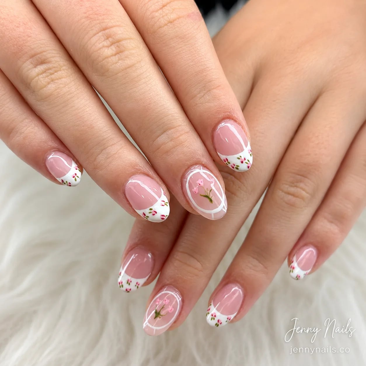 Glossy nude manicure with delicate white accents
